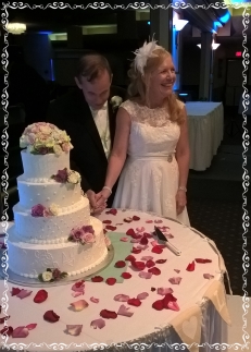 Joseph and Pamela cutting the the cake.